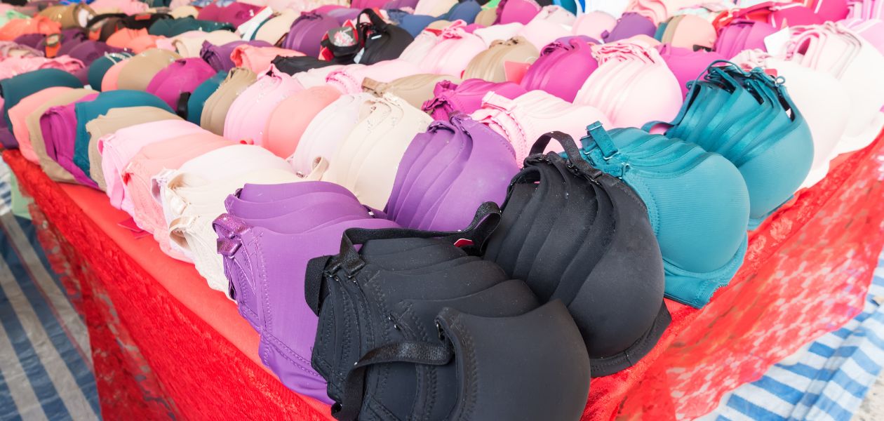 Colourful bras displayed on a table.
