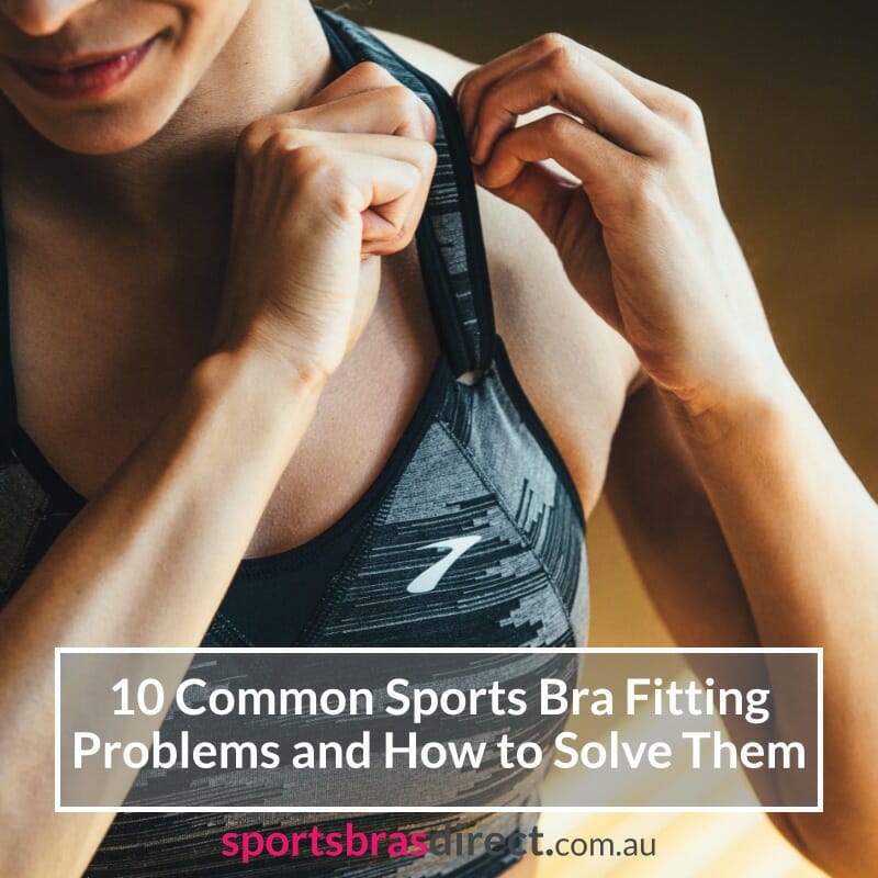 Woman adjusting her sports bra shoulder strap.