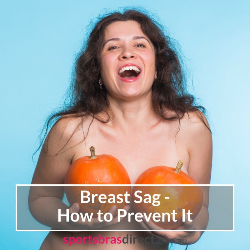 Women holding two pumpkins.