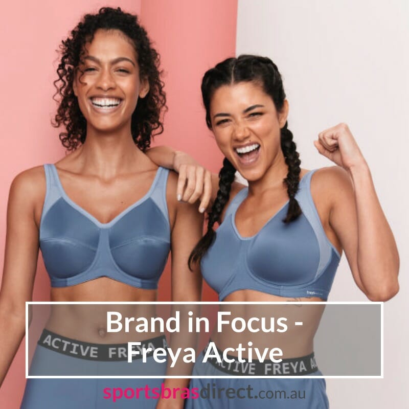 Two women standing together in Blue sports bras.