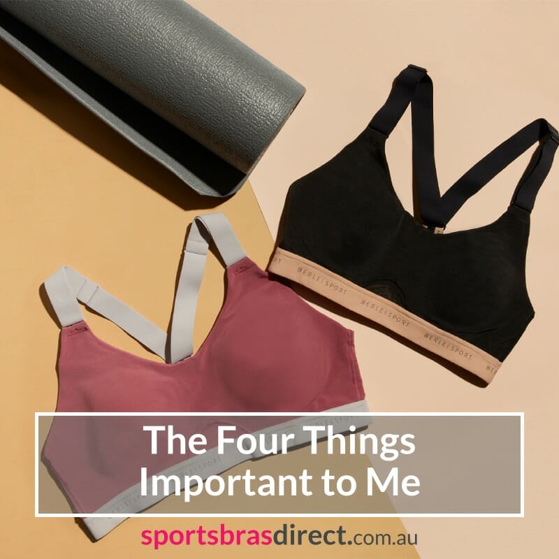 Two sports bras and a roller on the floor.