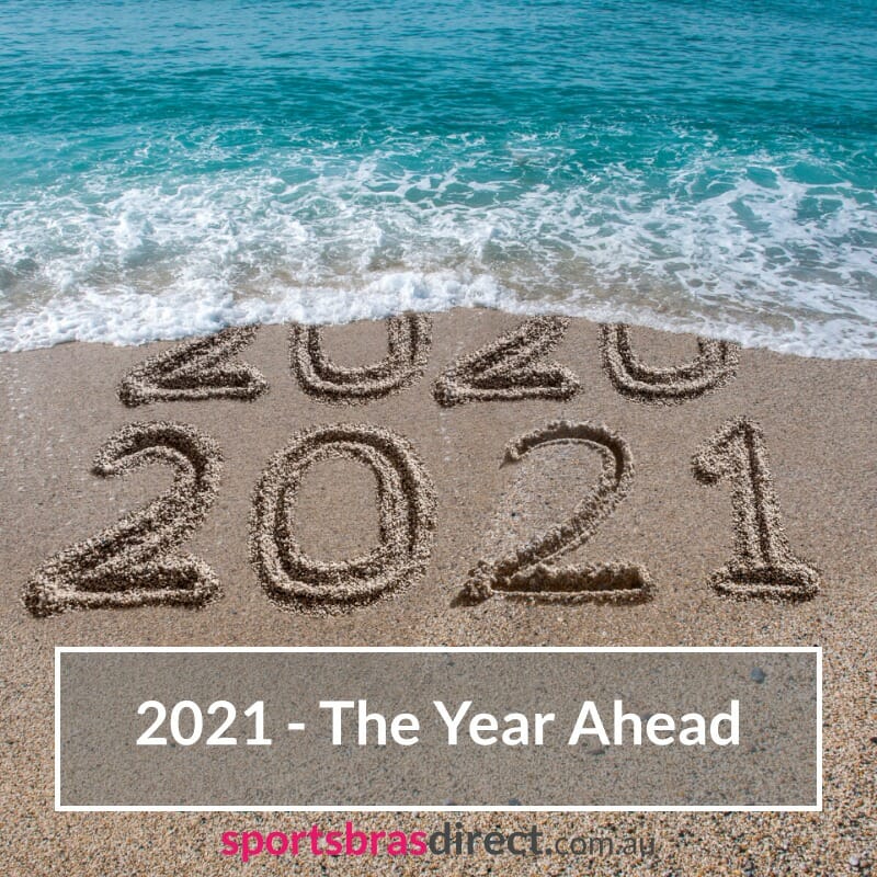 2021 written in the sand on a beach.