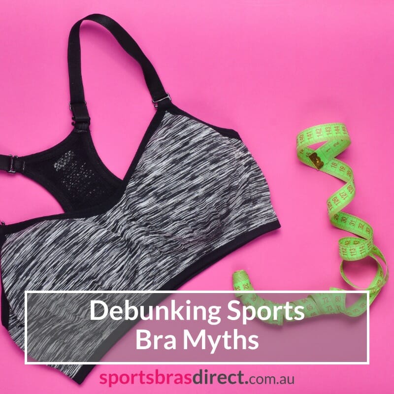 Sports bra and tape measure laid on a Pink background.