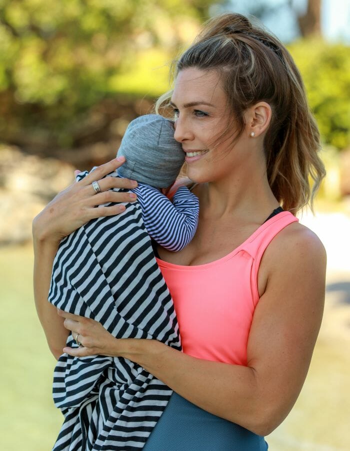 A mother holding her baby.