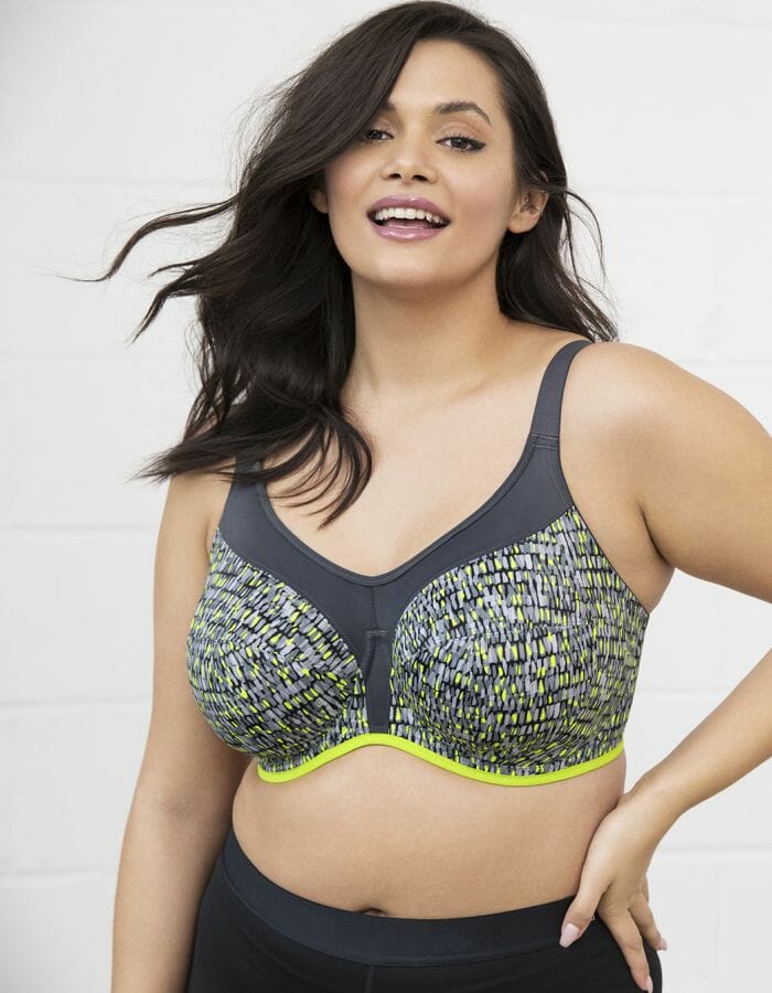 Woman in bright, multi-coloured sports bra