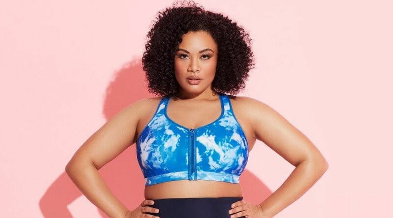 Woman wearing a colourful blue tie-dye sports bra.