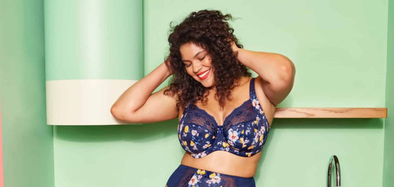Woman in colourful lingerie laughing.