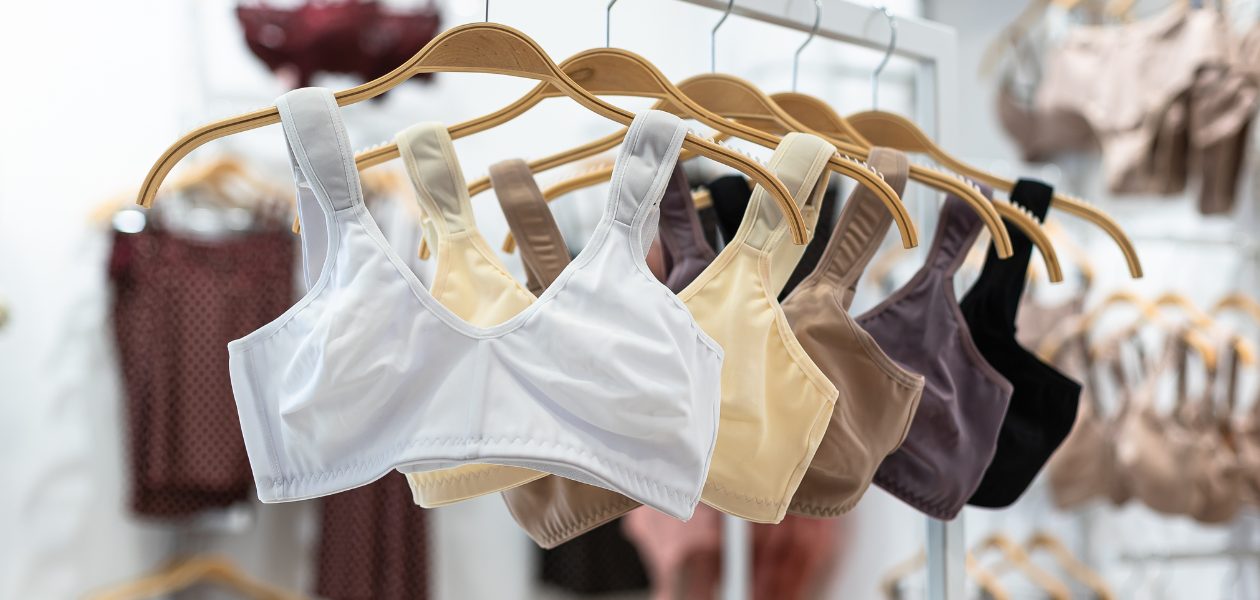 Bras displayed on hangers.