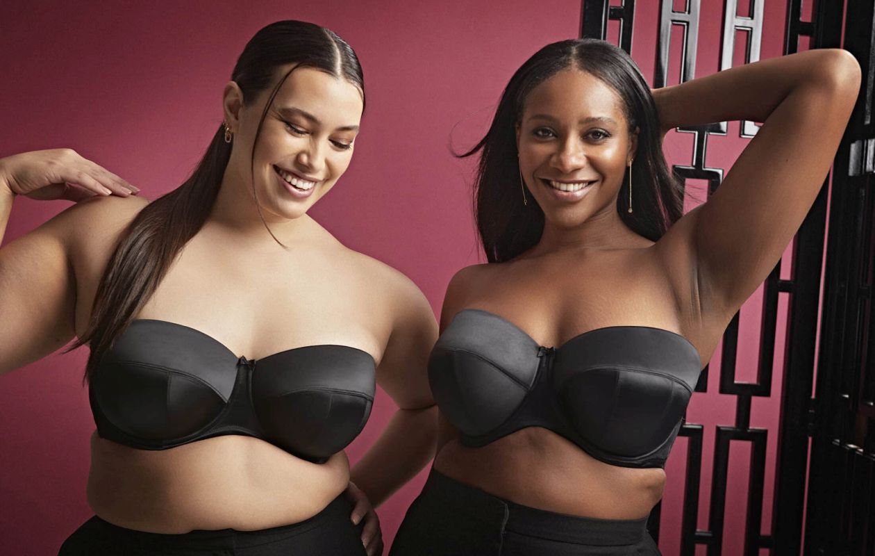 Two women wearing Black strapless bras.